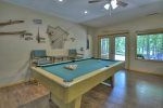 Basement Entertainment Area Features a Full Sized Pool Table